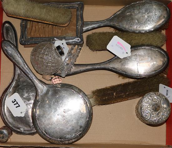 Two cut glass silver-mounted toilet jars, a four-piece dressing table set, 3 similar items, a photograph frame, etc (faults)